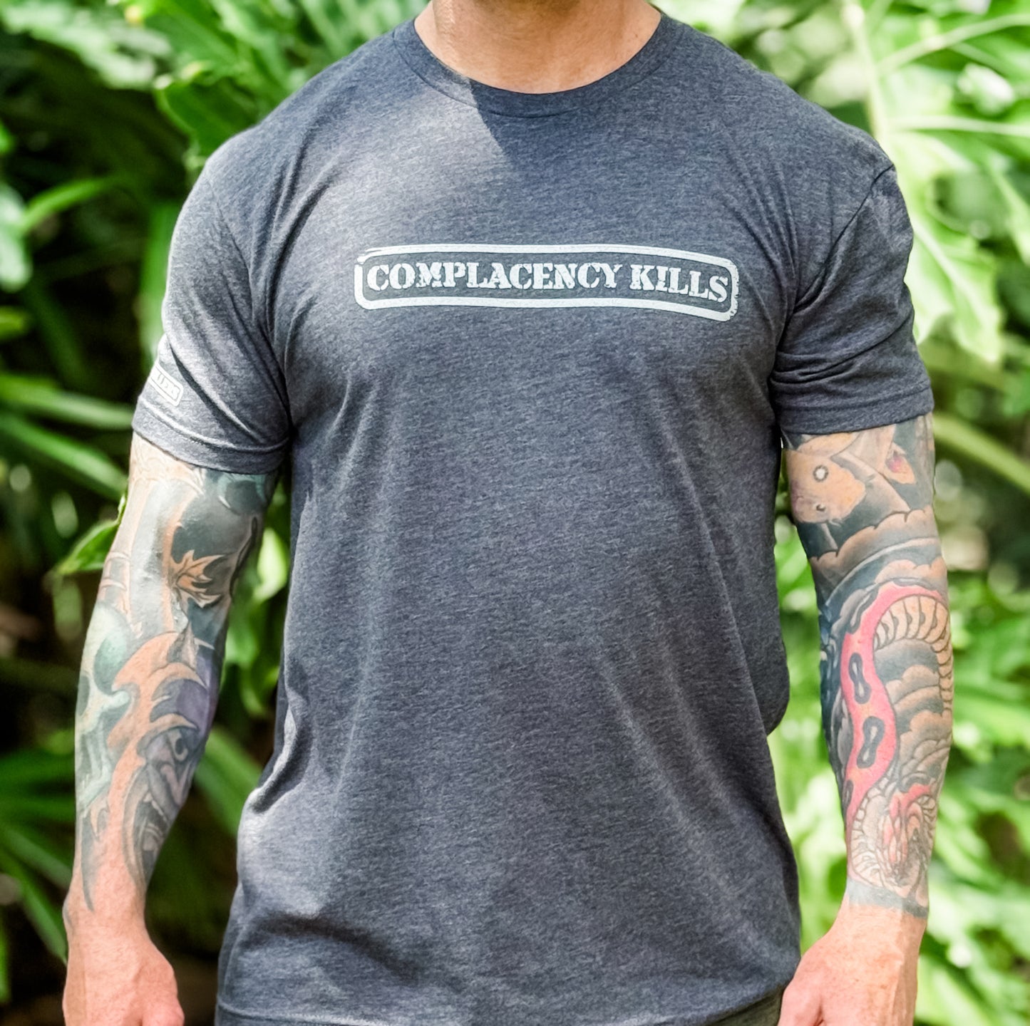 Complacency Kills Tee