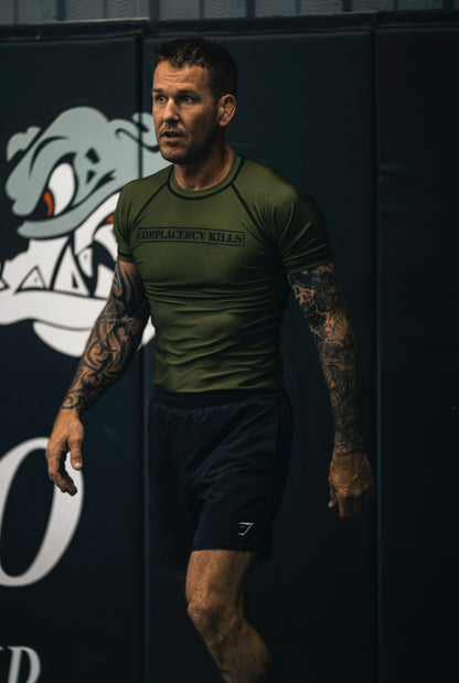Complacency Kills Rash Guard OD Green