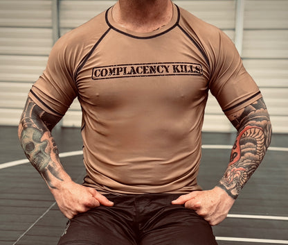 Complacency Kills Rash Guard Dark Earth